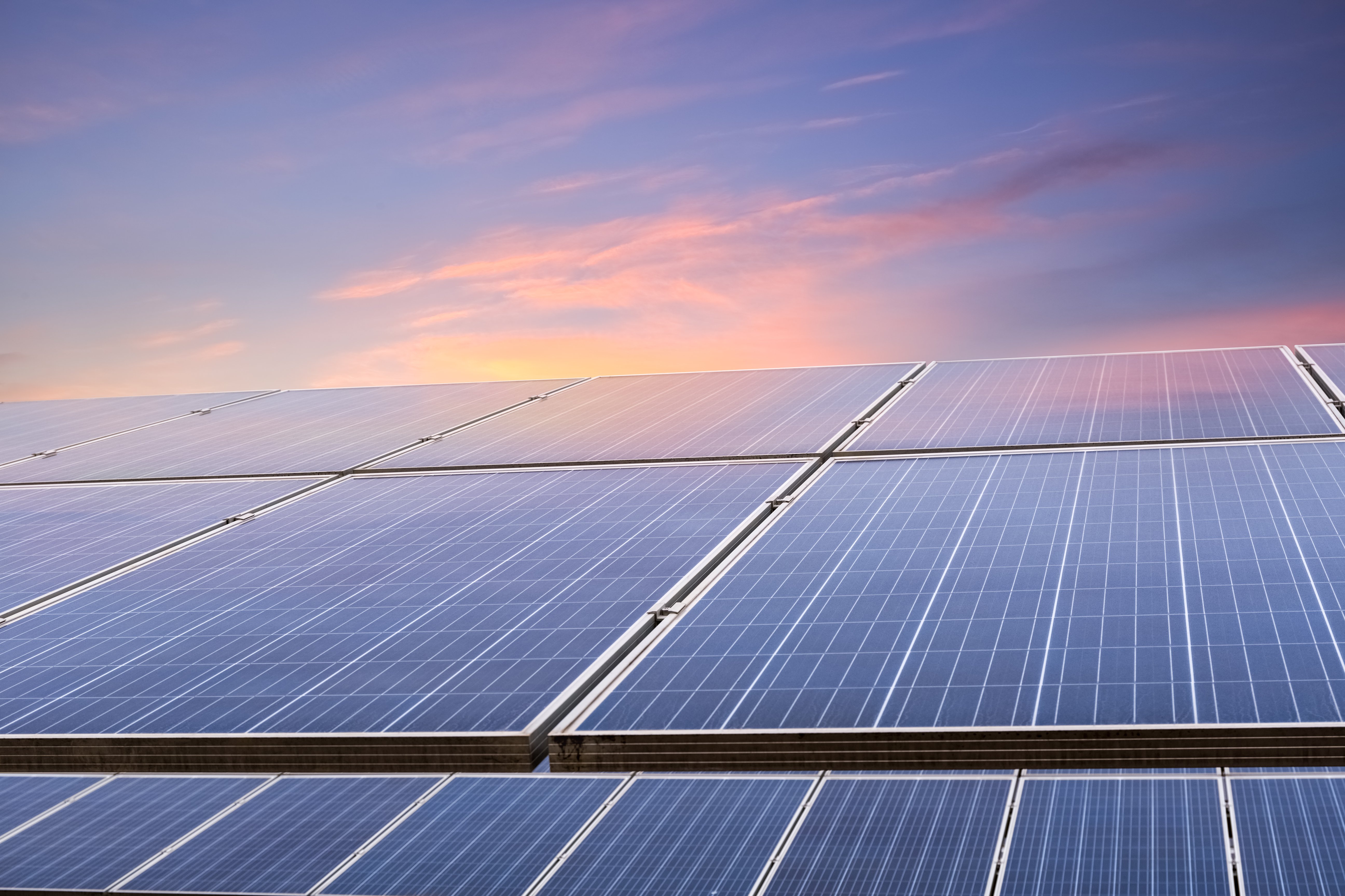 solar-energy-panels-closeupphotovoltaic-modules-reflect-sunset-light-clouds
